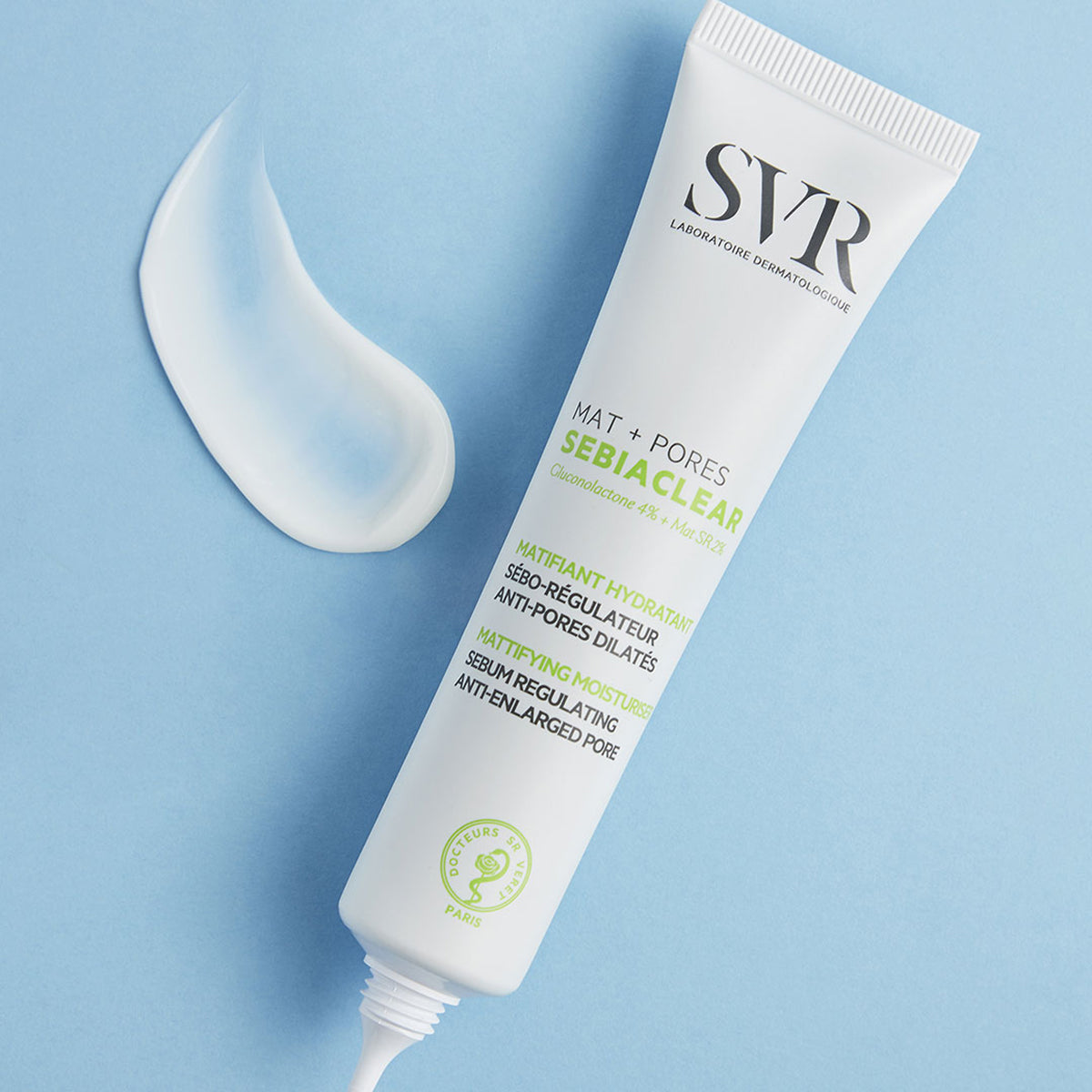 SVR Sebiaclear Mat+Pores white squeeze tube with a dollop of cream on a light blue background.