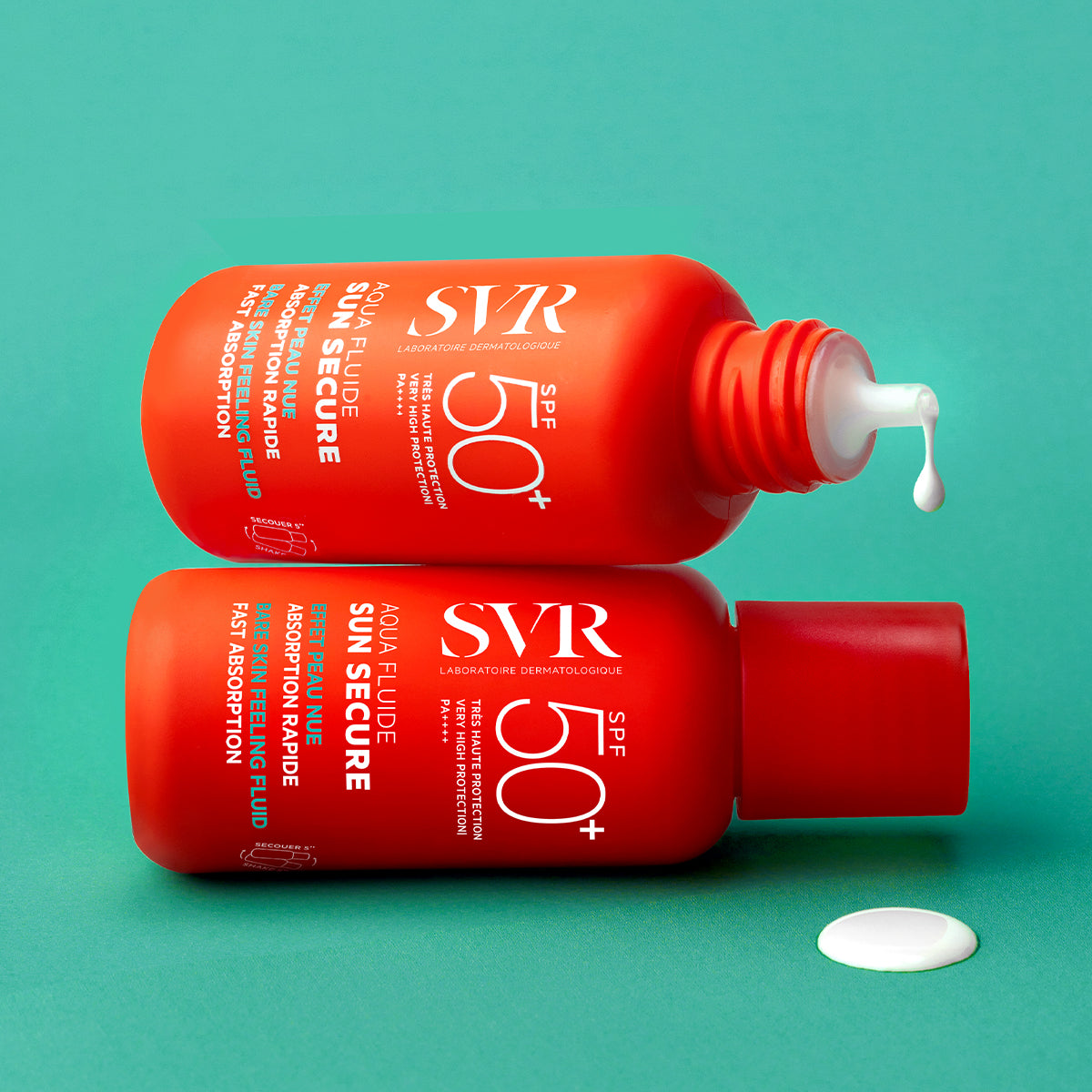 Two orange SVR SUN SECURE SPF50+ sunscreen bottles stacked on a teal background with a drop of white fluid.