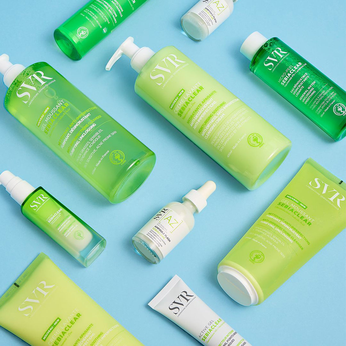 SVR Sebiaclear skincare collection featuring green and white bottles, tubes, and a dropper serum on a light blue background.
