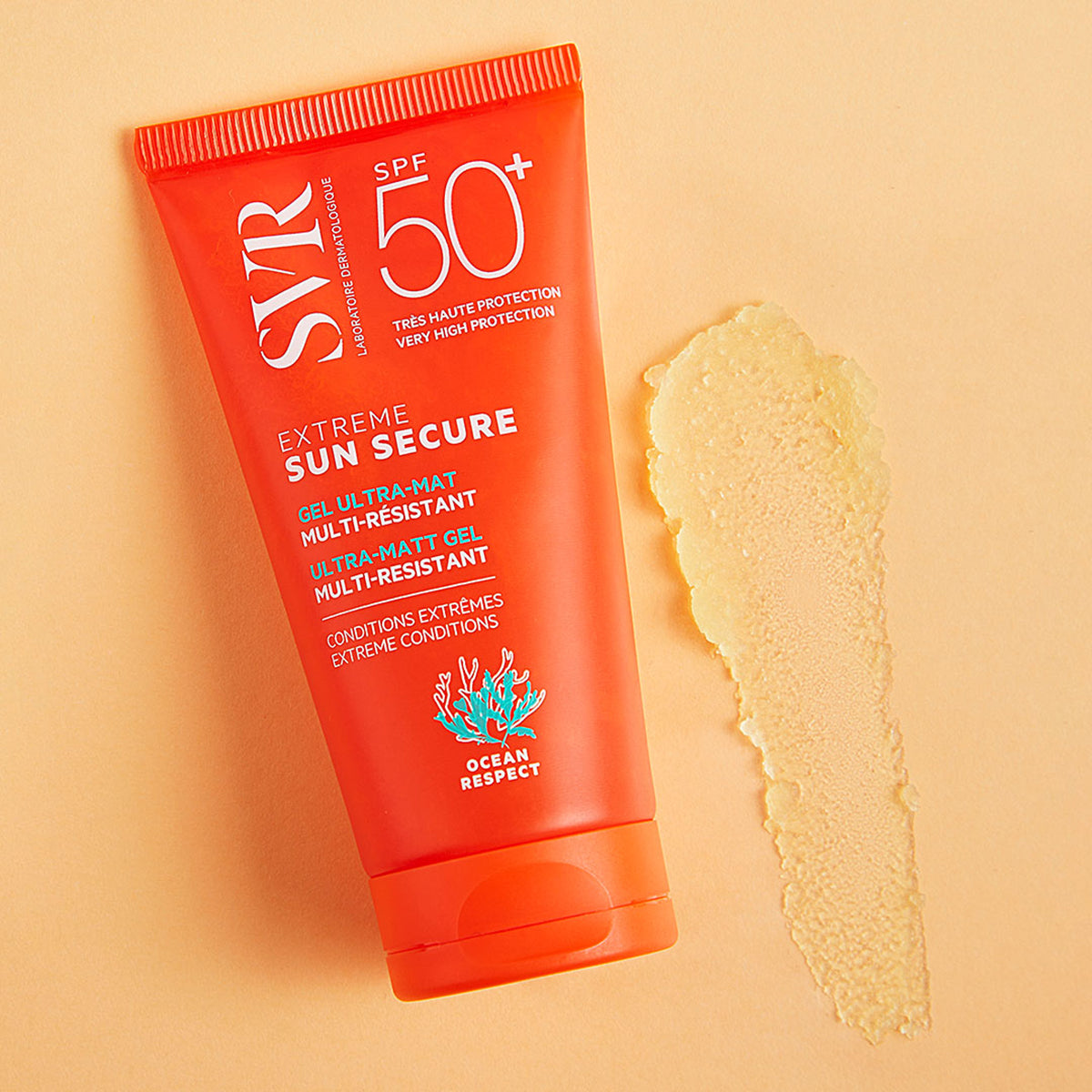 Orange SVR SUN SECURE Extrême SPF50+ tube with a smear of transparent matte gel on a light peach background.