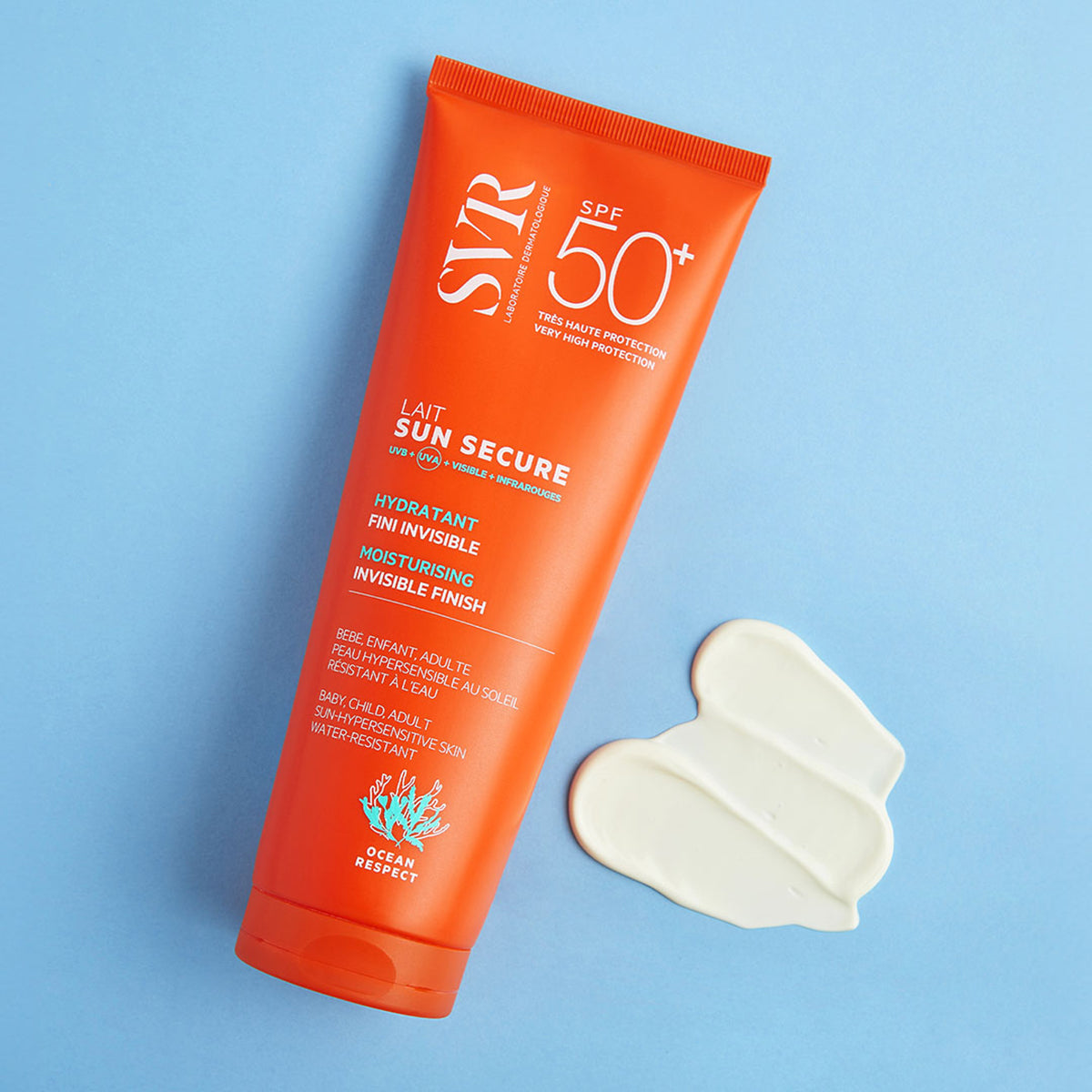 Orange SVR SUN SECURE SPF50+ sunscreen tube with a dollop of white cream on a light blue background.