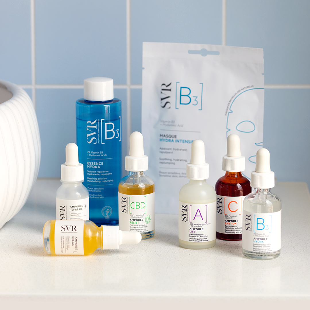 SVR Ampoule Lift serum bottle with dropper, surrounded by various SVR skincare products on a white counter.